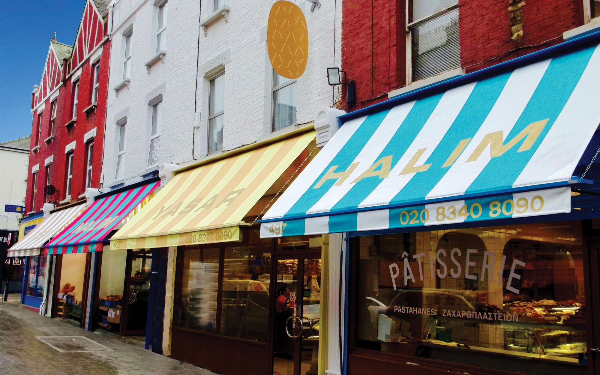 Commercial Awnings with colorful fabric stripes 